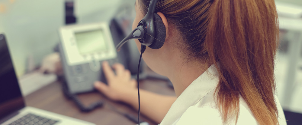 Female dispatch worker on the phone